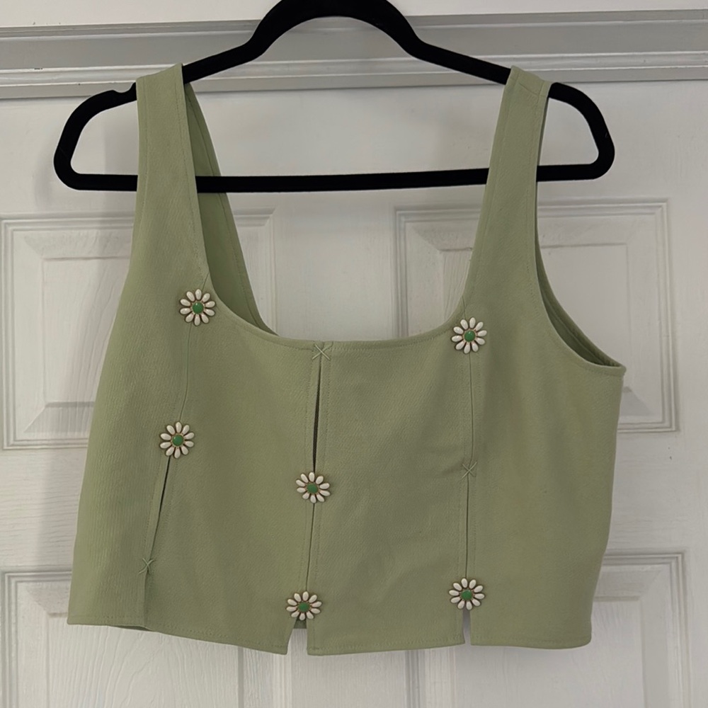 Green Sleeveless Top with Floral Accents